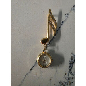 Women's QUINIEL Gold Tone Music Note Brooch Watch, One Size